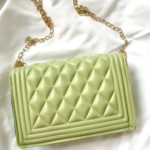 Green quilted crossbody bag, sure to make heads turn.